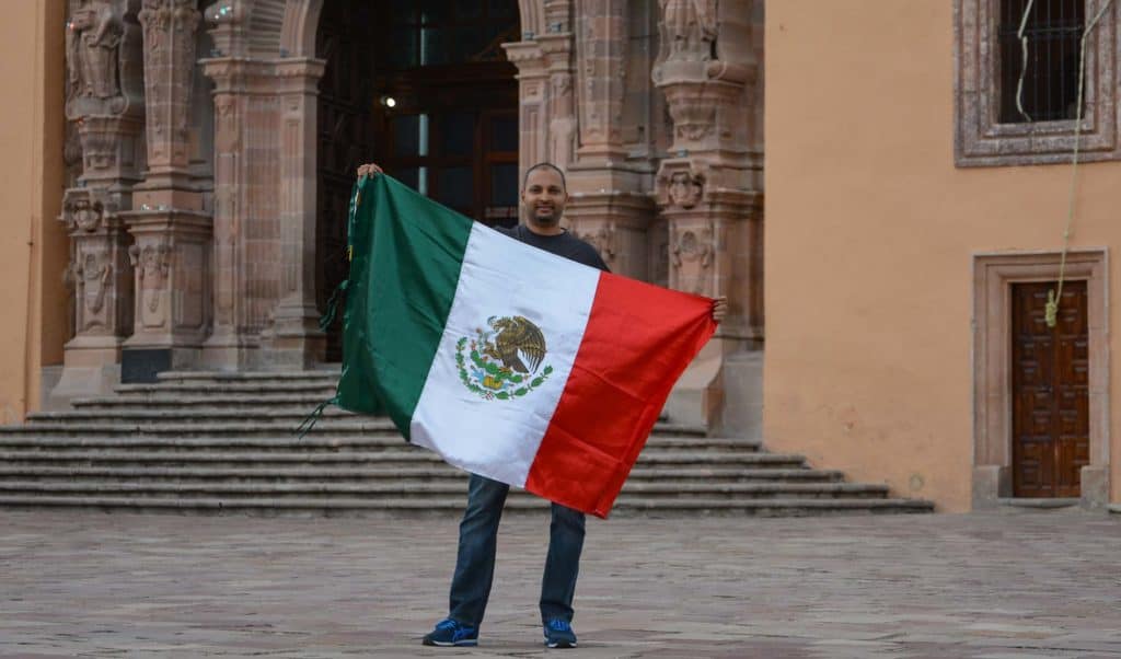 Thirumal Motati Holding Mexican Flag in Dolores Hidalgo